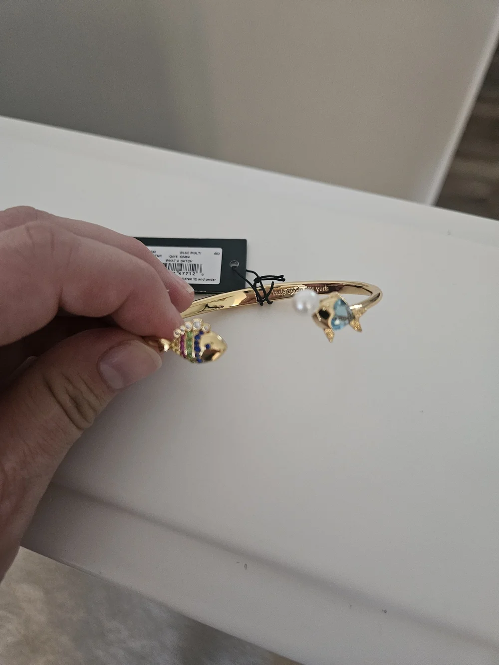 kate spade Gold Open Bangle with Blue Crystal Fish and Pearl Accent - Picture 2 of 6
